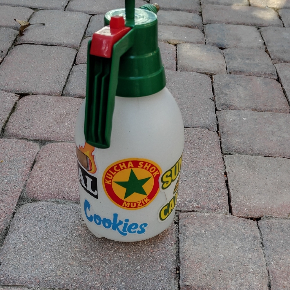 Green and White Kulcha Shok Muzik Spray Bottle
